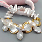 Pearl bracelet with gold accents on a gray background