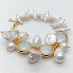 Pearl bracelet with gold accents on a white background
