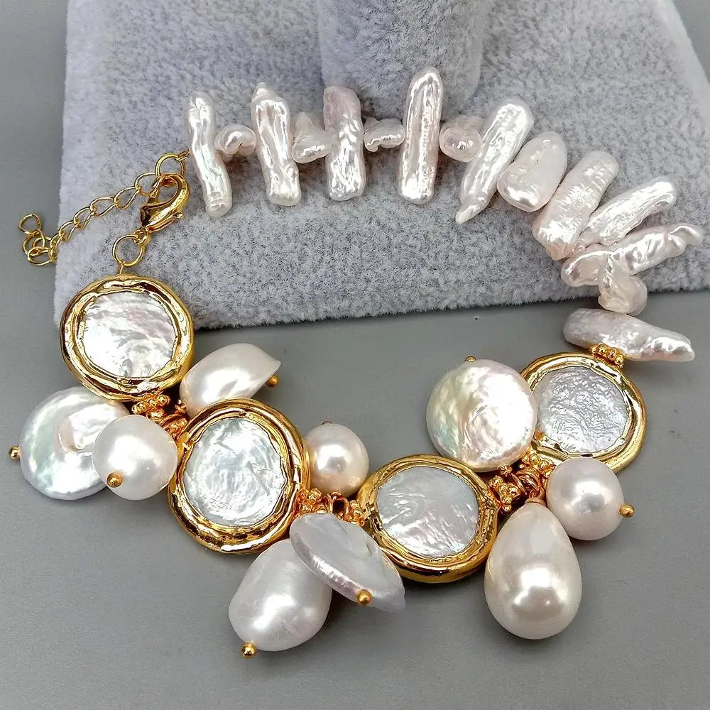 Pearl bracelet with gold accents on a gray surface