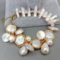 Pearl bracelet with gold accents on a gray surface