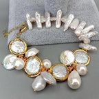 Pearl bracelet with gold accents on a gray surface