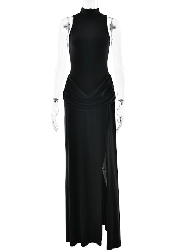 Black evening gown on a mannequin against a white background