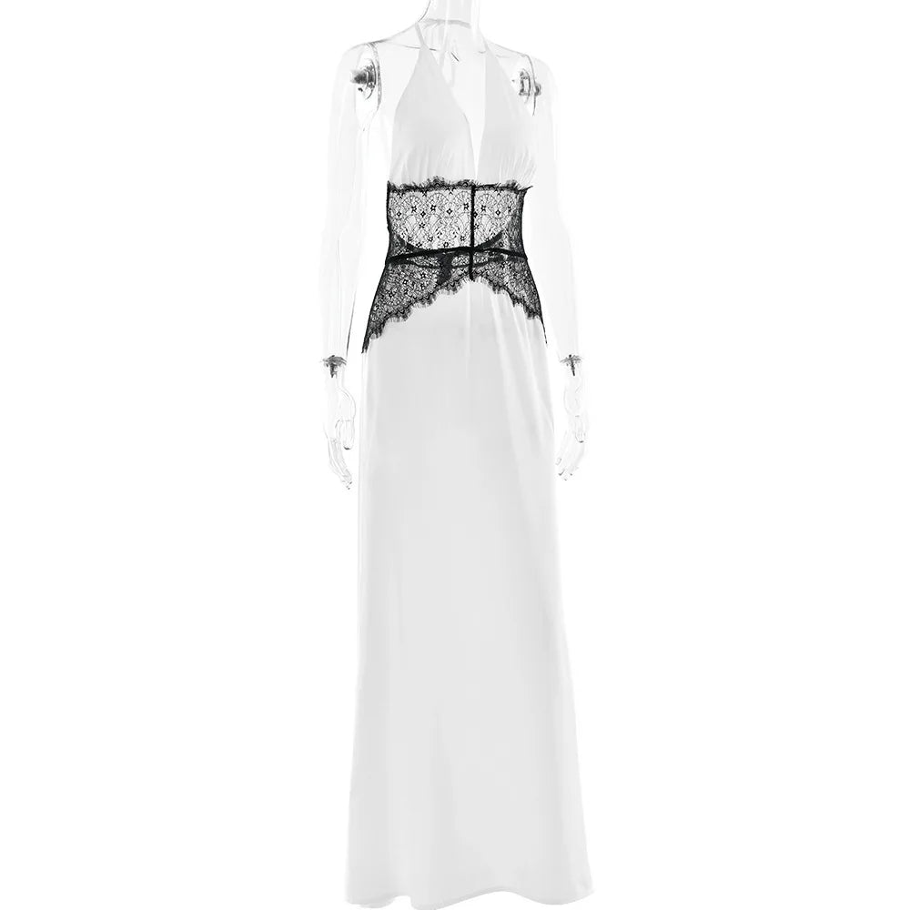 White dress with black lace detailing on a white background