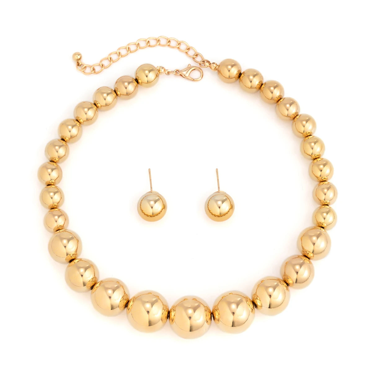 Gold beaded necklace and earrings set on a white background