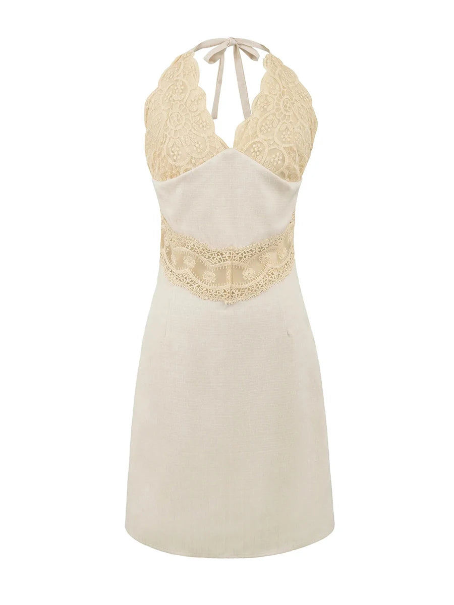 Beige halter neck dress with lace detailing on a white background