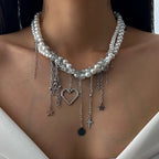 Necklace with pearls and various charms on a person's neck