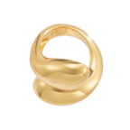 Gold ring with a unique design on a white background