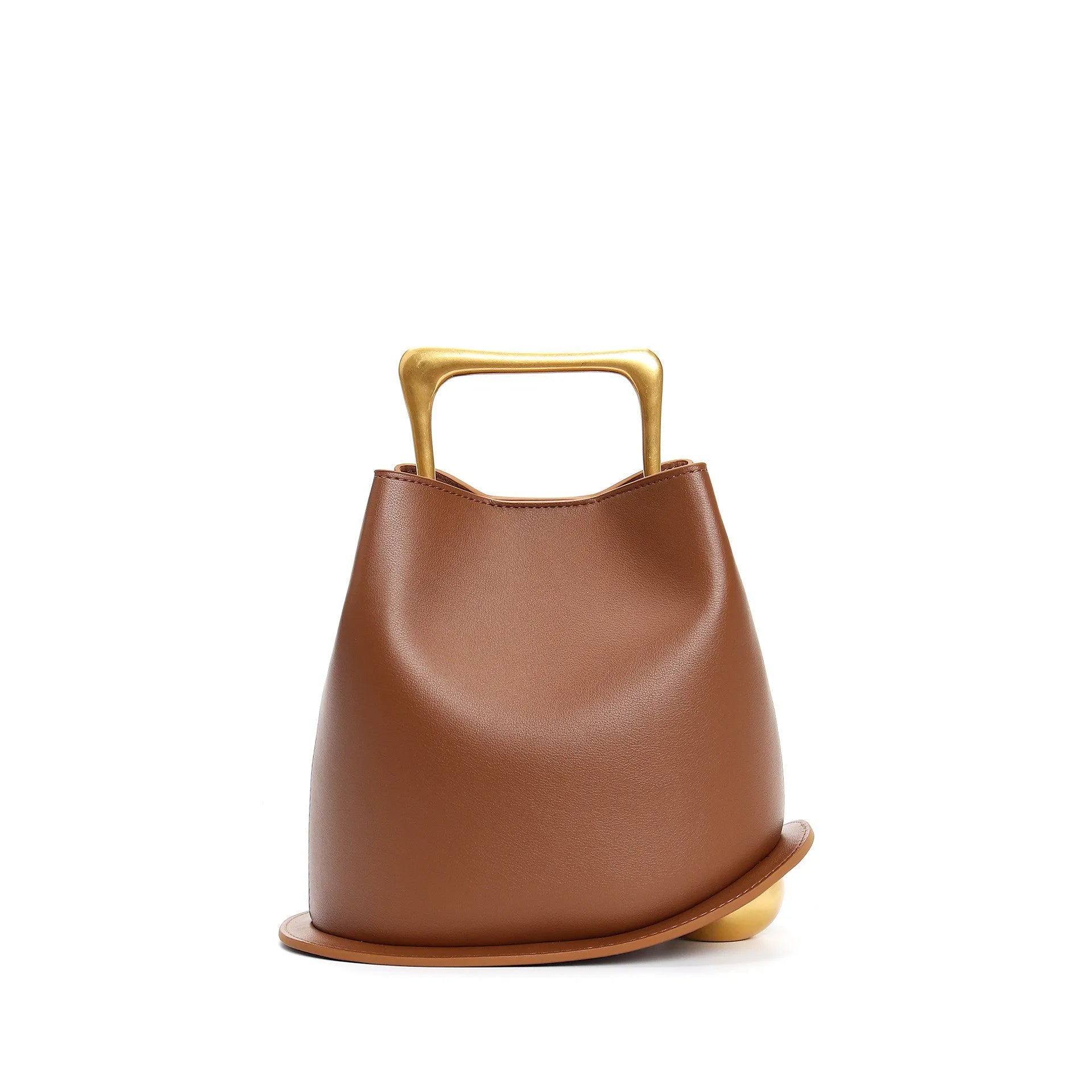 Brown leather handbag with gold handle on a white background