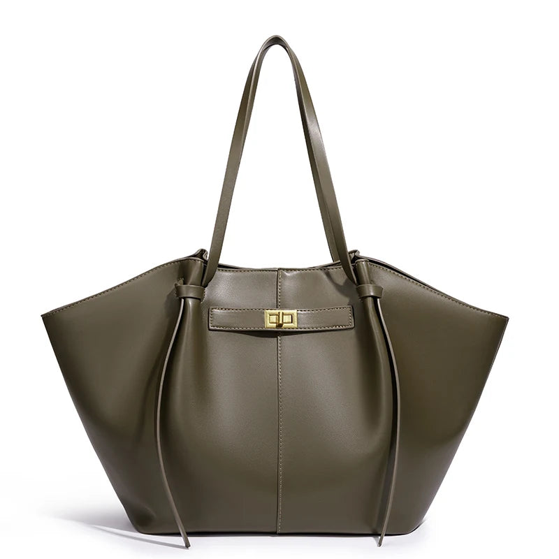 Green handbag with a gold clasp on a white background