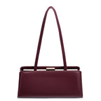 Maroon handbag with a gold clasp on a white background