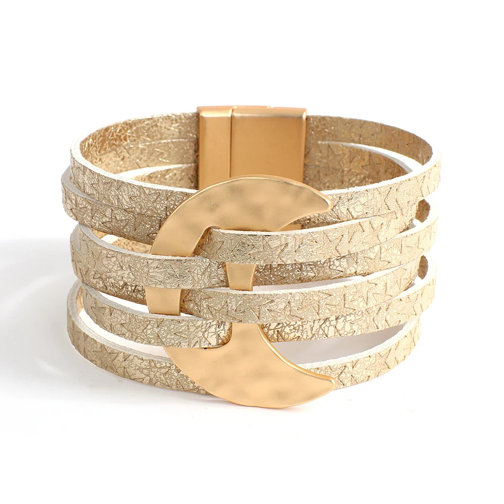 Multi-layered bracelet with gold and beige accents on a white background