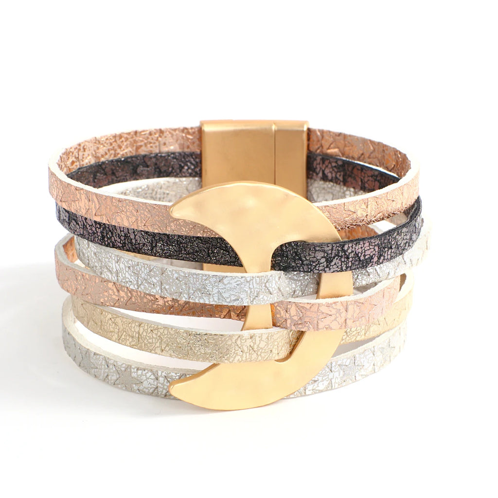 Stack of multicolored leather bracelets with gold accents on a white background