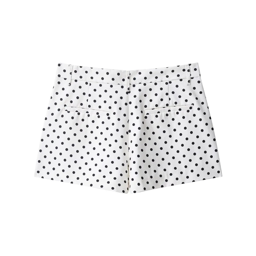 White shorts with black polka dots on a white background