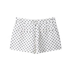 White shorts with black polka dots on a white background
