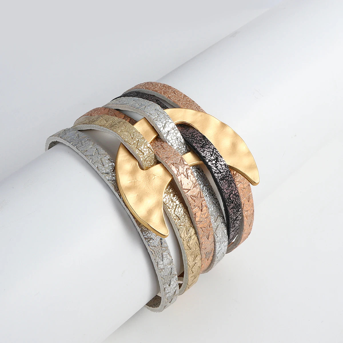 Multicolored cuff bracelet on a light gray background