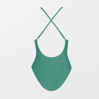 Green swimsuit with thin straps on a light gray background