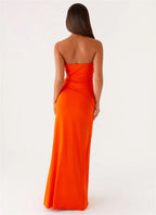 Orange strapless gown on a white background