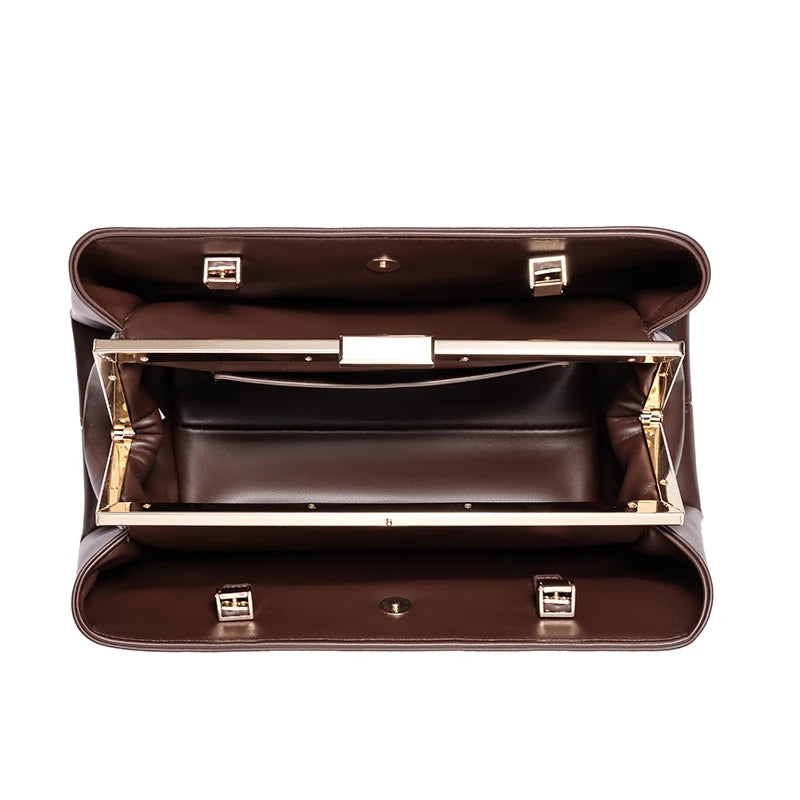 Brown leather briefcase with gold accents on a white background