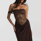Brown lace dress with draped fabric on a plain background