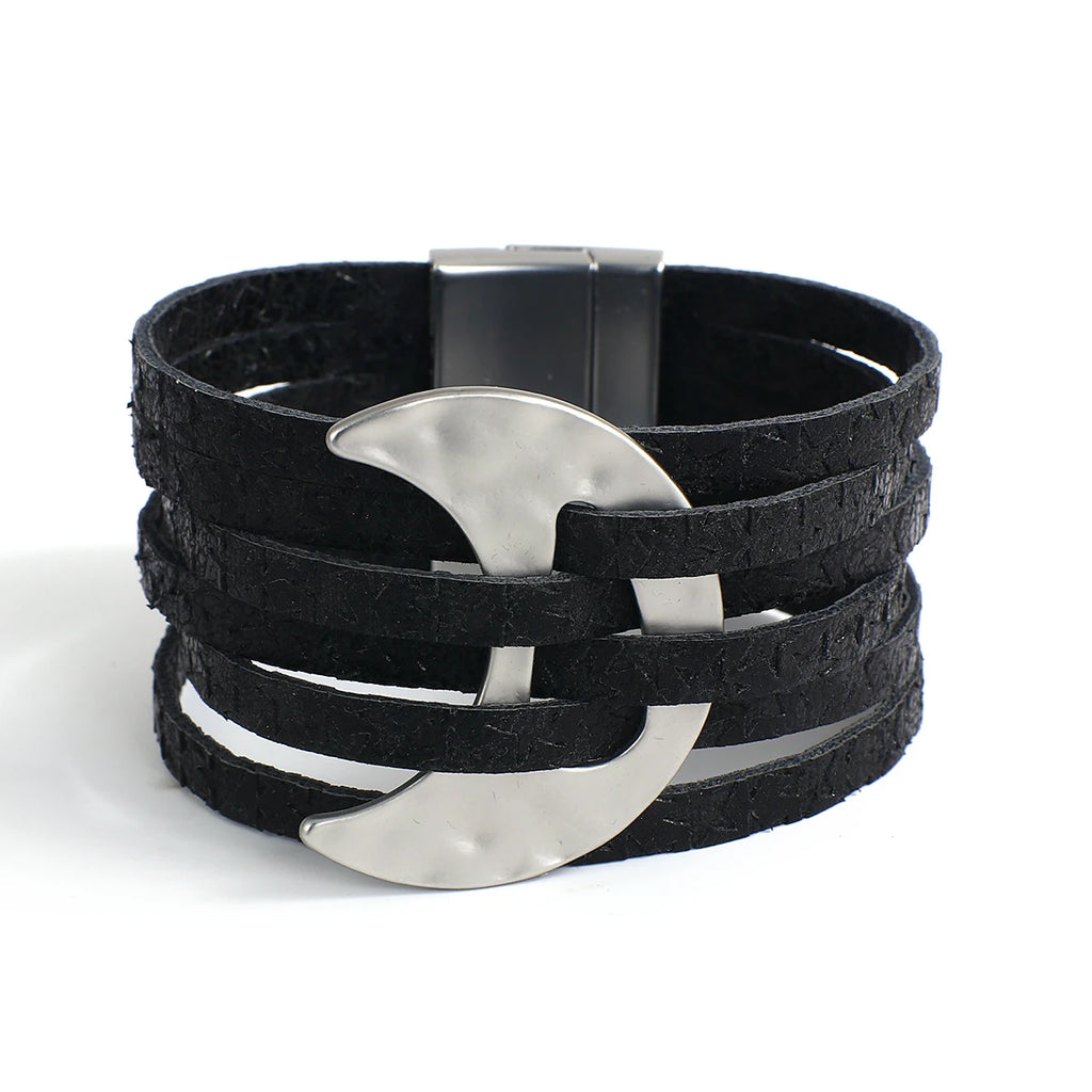 Black leather bracelet with silver crescent moon charm on a white background