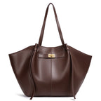 Brown leather handbag with a gold clasp on a white background