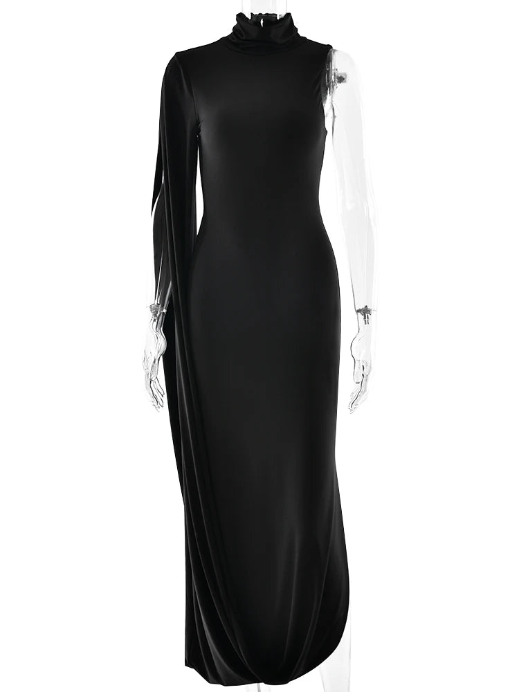 Black evening gown with sheer sleeves on a white background