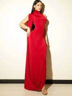 Woman wearing a red evening gown against a plain background