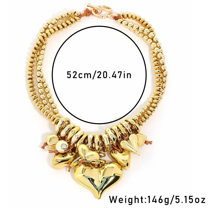 Gold bracelet with heart charms and measurement details on a white background