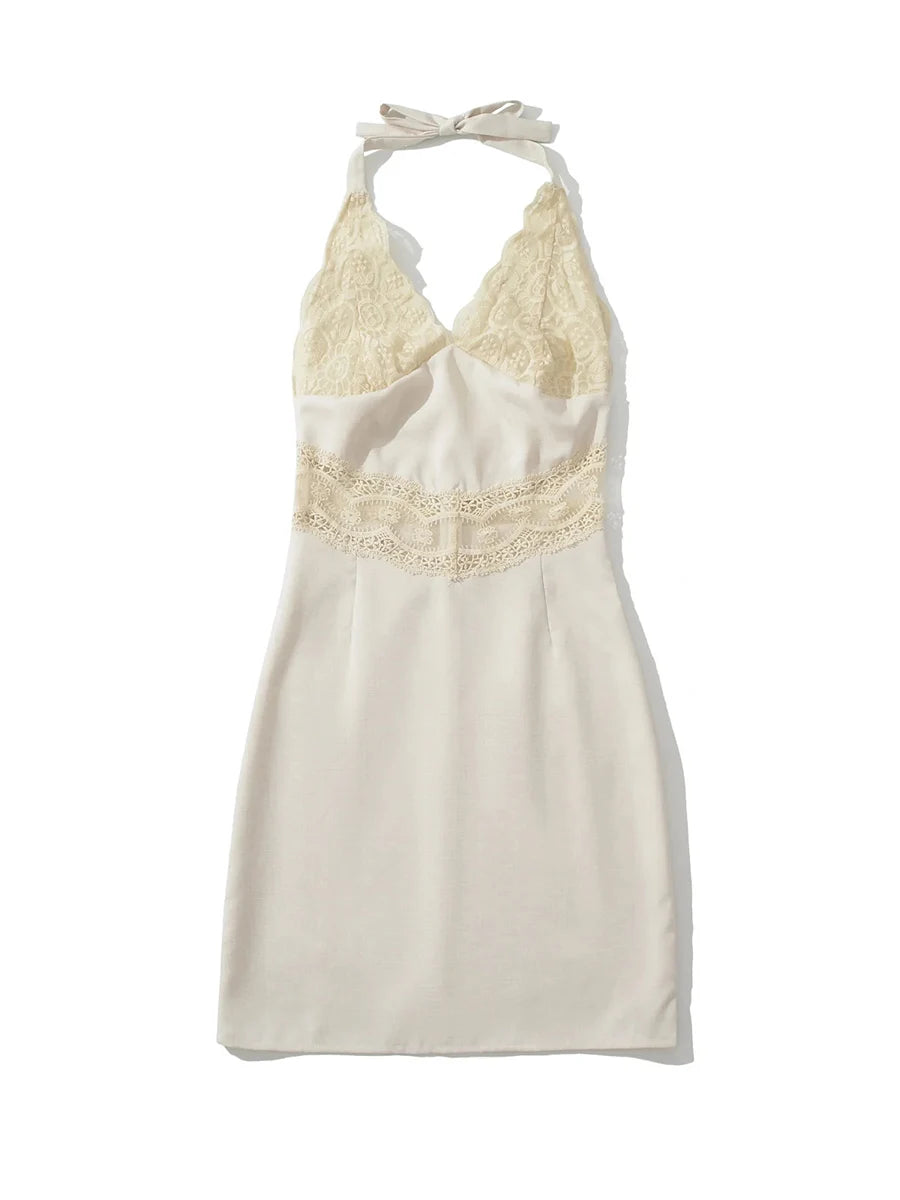 White halter neck dress with lace detailing on a white background