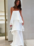 Woman wearing a white dress in a store setting