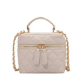 Beige quilted handbag with gold chain strap on a white background