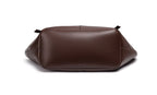 Brown leather bag on a white background