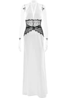 White dress with black lace detailing on a white background