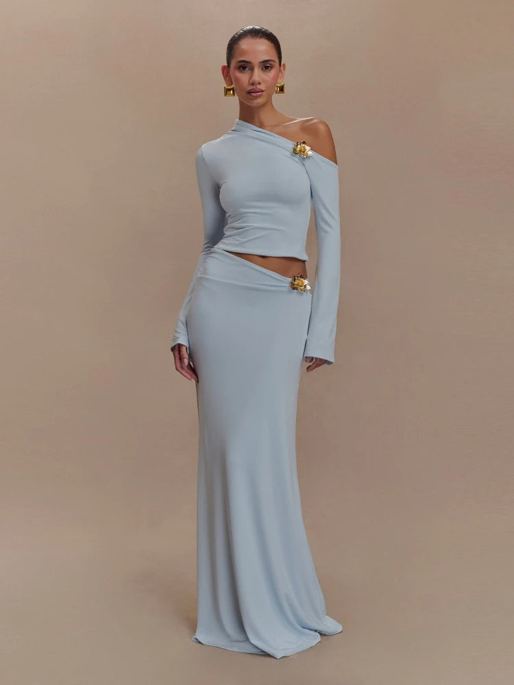 Woman wearing a light blue off-shoulder dress with a belt on a beige background