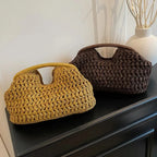 Two crocheted handbags, one yellow and one brown, on a dark surface with a light background.