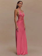 Woman wearing a pink evening gown against a beige background