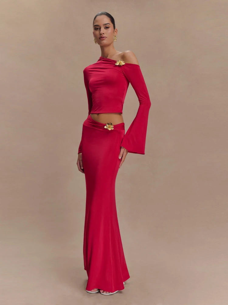 Woman wearing a red off-shoulder dress with a belt on a beige background