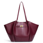 Maroon handbag with a gold clasp on a white background
