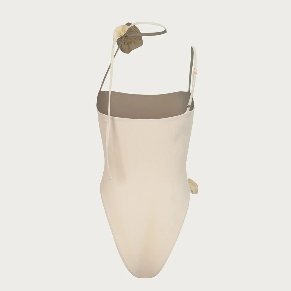 Beige swimsuit with a green top on a white background