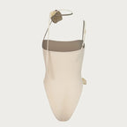 Beige swimsuit with a green top on a white background