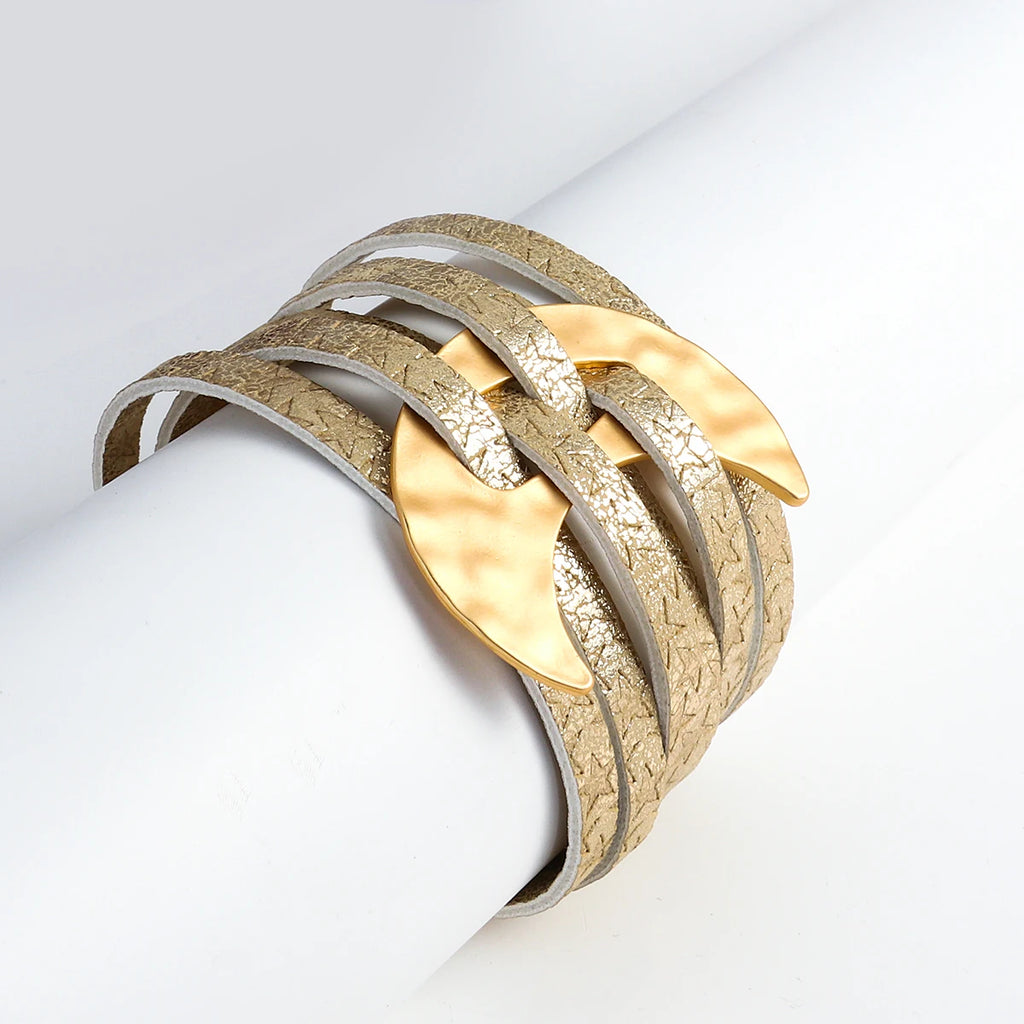 Gold and silver bracelet on a light gray background