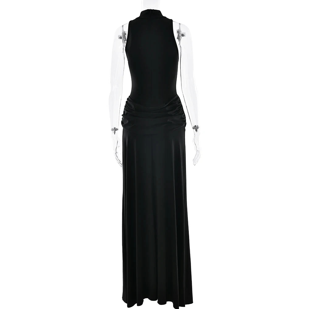 Black evening gown on a mannequin against a white background