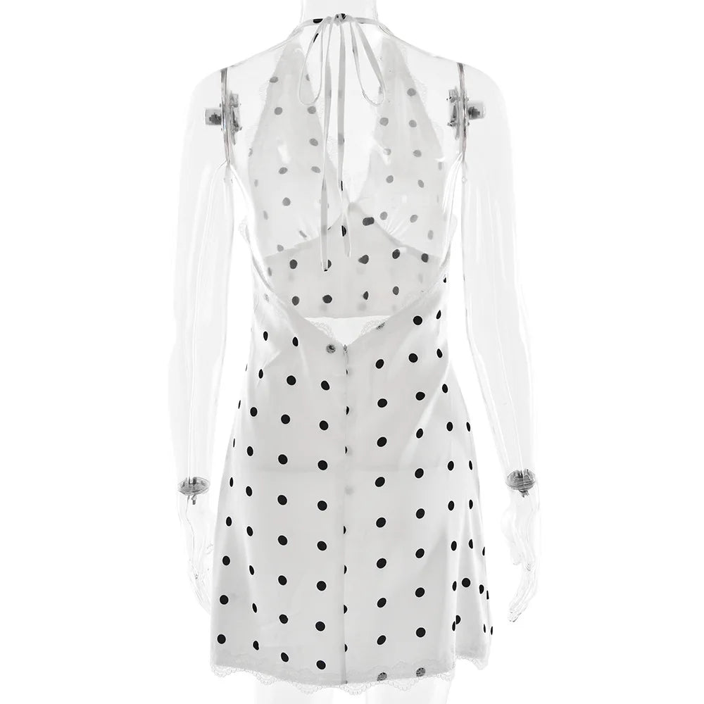 White dress with black polka dots on a white background