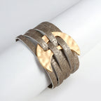 Bracelet with gold and silver design on a white background