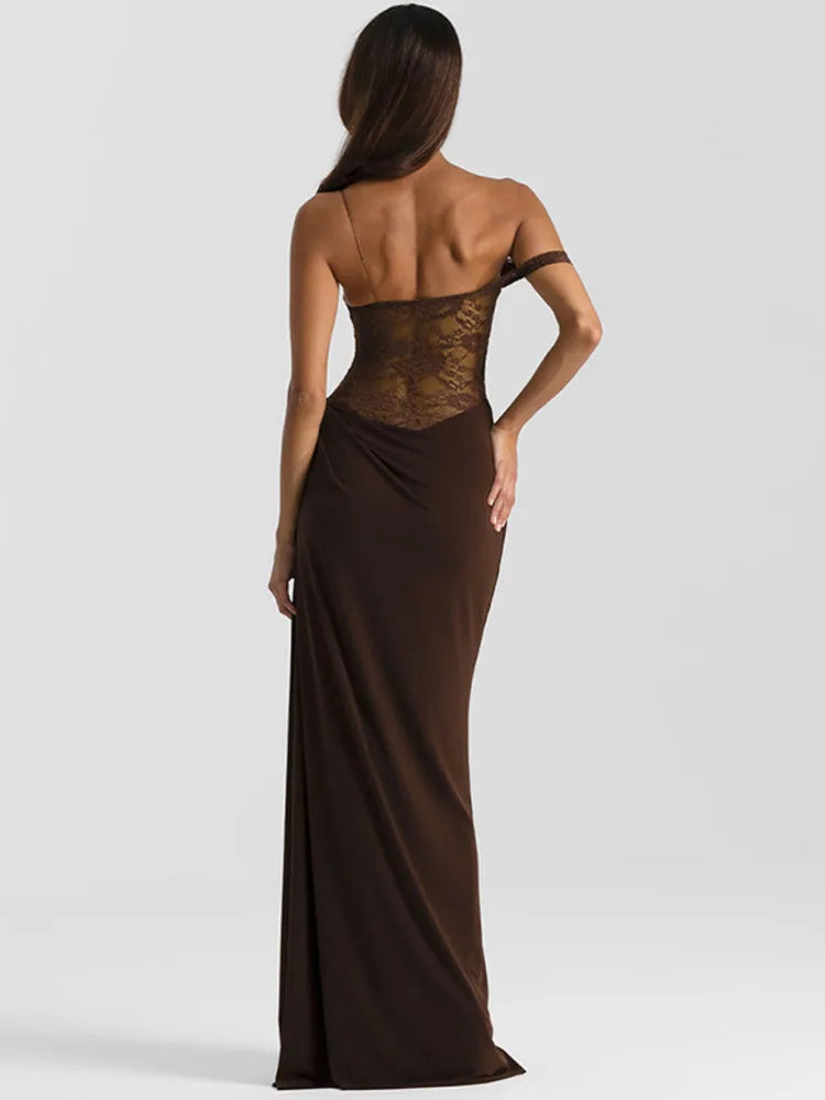 Woman wearing a brown evening gown with lace detailing on a white background