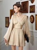 Woman wearing a beige dress in an art gallery