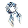 A blue and white floral scarf tied in a knot.