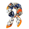 A headband scarf with a paisley pattern in blue, orange, and white colors.
