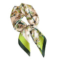 A multicolored floral patterned silk scarf wrapped around a headband.